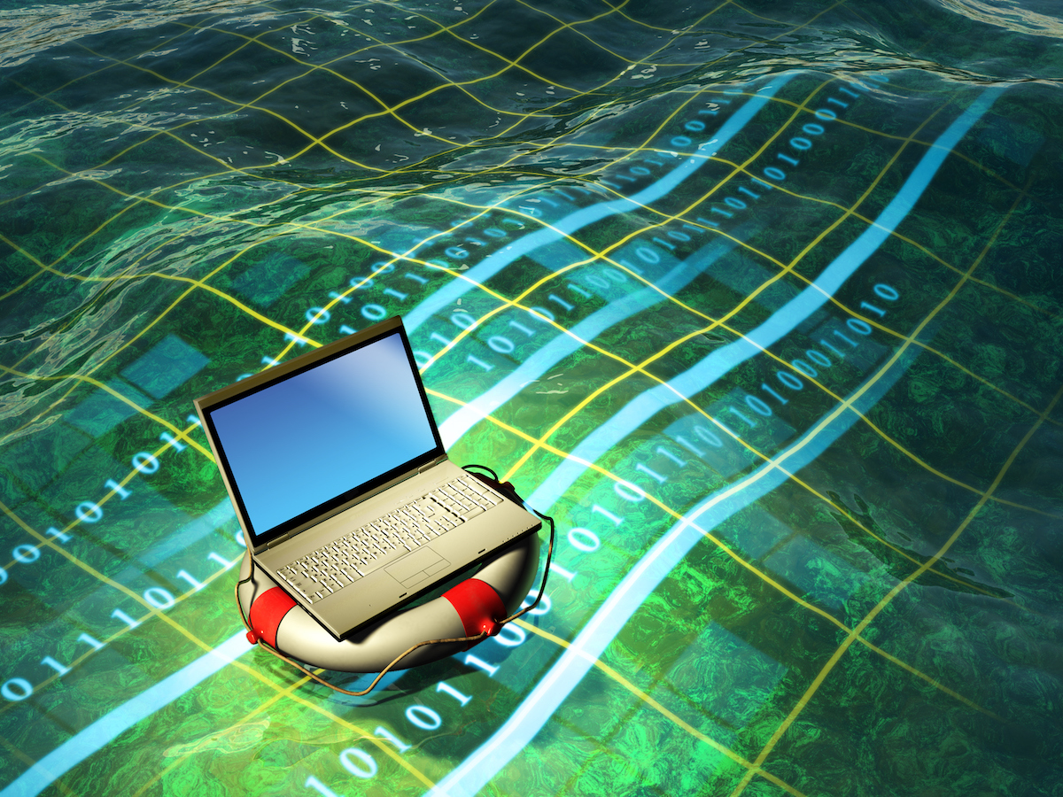 A modern laptop floating in a digital sea showcasing need for cyber insurance.